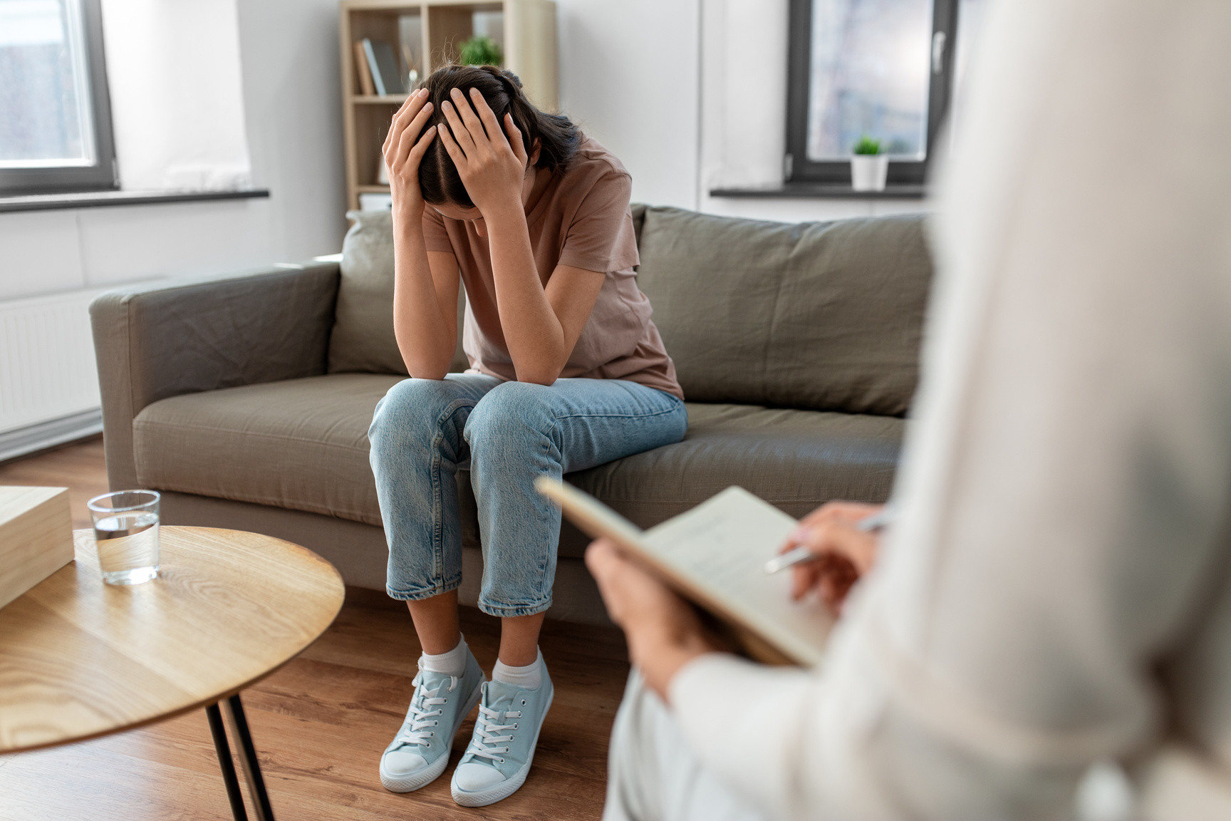 Woman and Psychologist at Psychotherapy Session
